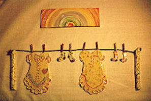 More laundry room clothesline relief tiles